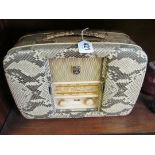 A very stylish vintage Ultra radio Twin-de-Lux in snakeskin type case with sliding doors