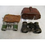 A pair of binoculars in leather case and a pair of opera glasses