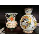 A Faience jug decorated cherubs, griffins and classical figures (a/f) and a Falcon ware Art Deco