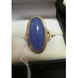 A 9ct gold ring set oval blue stone.