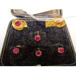 A pair gold and garnet cufflinks and some studs