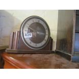 A Metamec electric clock and another