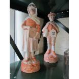 A pair of late Victorian bisque figures man and lady