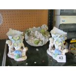 A Victorian flower encrusted jardiniere (a/f) and two 19th Century vases applied cherubs and