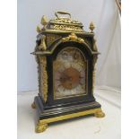 A 19th Century ebonised and gilt bracket clock cushion top and gilt side grills, eight day chiming