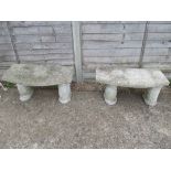 A pair of concrete circular benches.