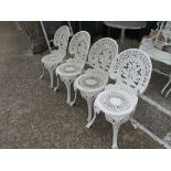 Four white garden chairs