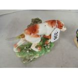 A 19th Century Staffordshire dog on bocage base (restored)