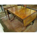 A Regency mahogany and rosewood banded sofa table, two drawers on twin splayed legs