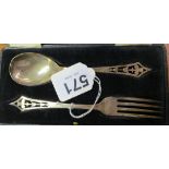 A silver spoon and fork with stylized floral terminals (i.c)