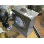 A pewter clock retailed Walker & Hall