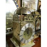 A brass lantern clock with single fusee movement engraved dial inscribed John Aylnard, Bramsford