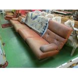 A Tetrad Neucleus brown leather three seater designer settee on chrome supports and a similar chair.