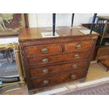 A 19th Century oak chest of two short and three long drawers on brass handles on bracket feet