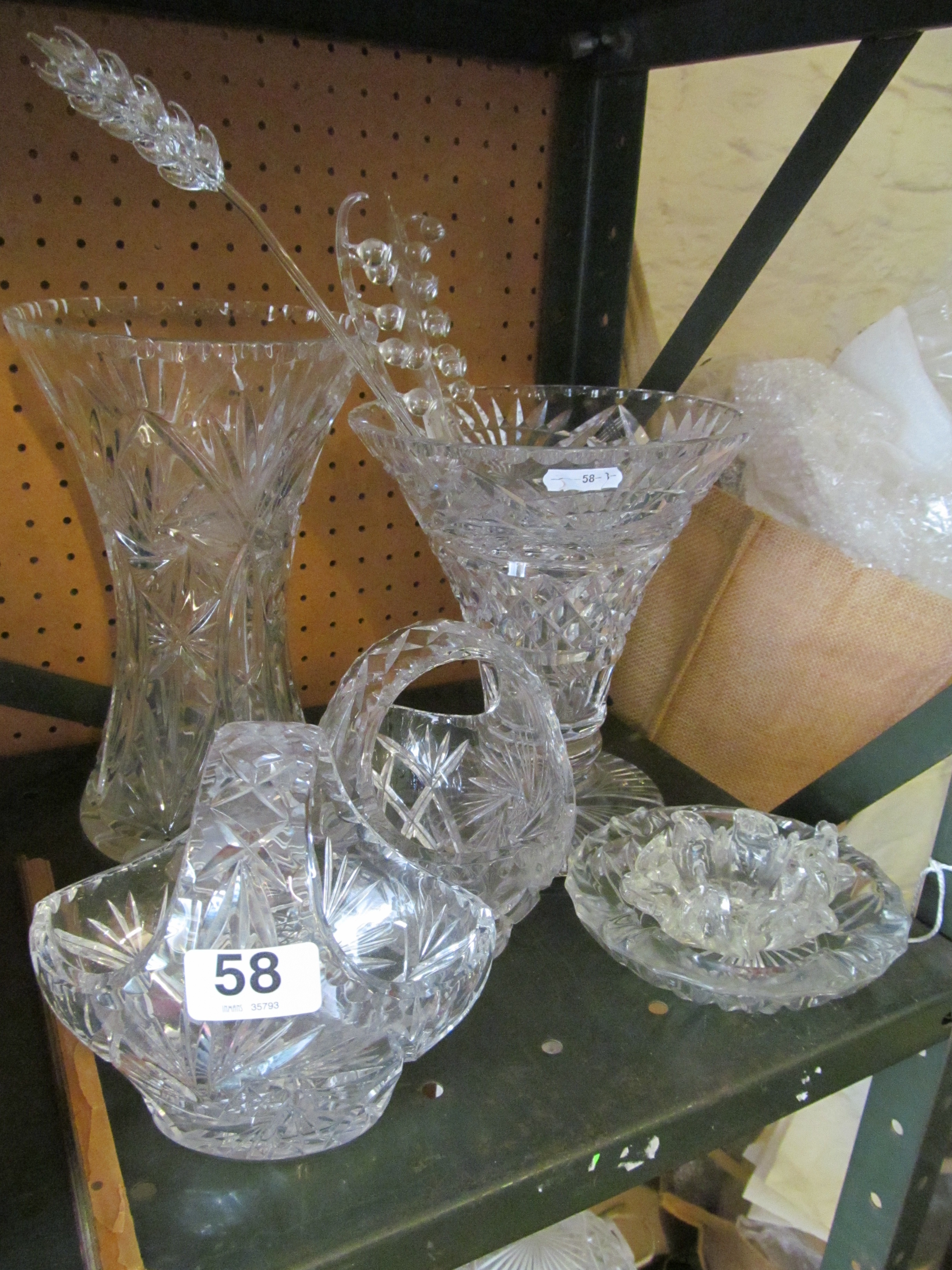 Two large cut glass vases and other cut glass.