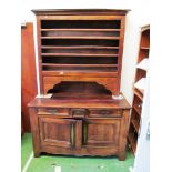 A heavy continental elm dresser the back with slats.