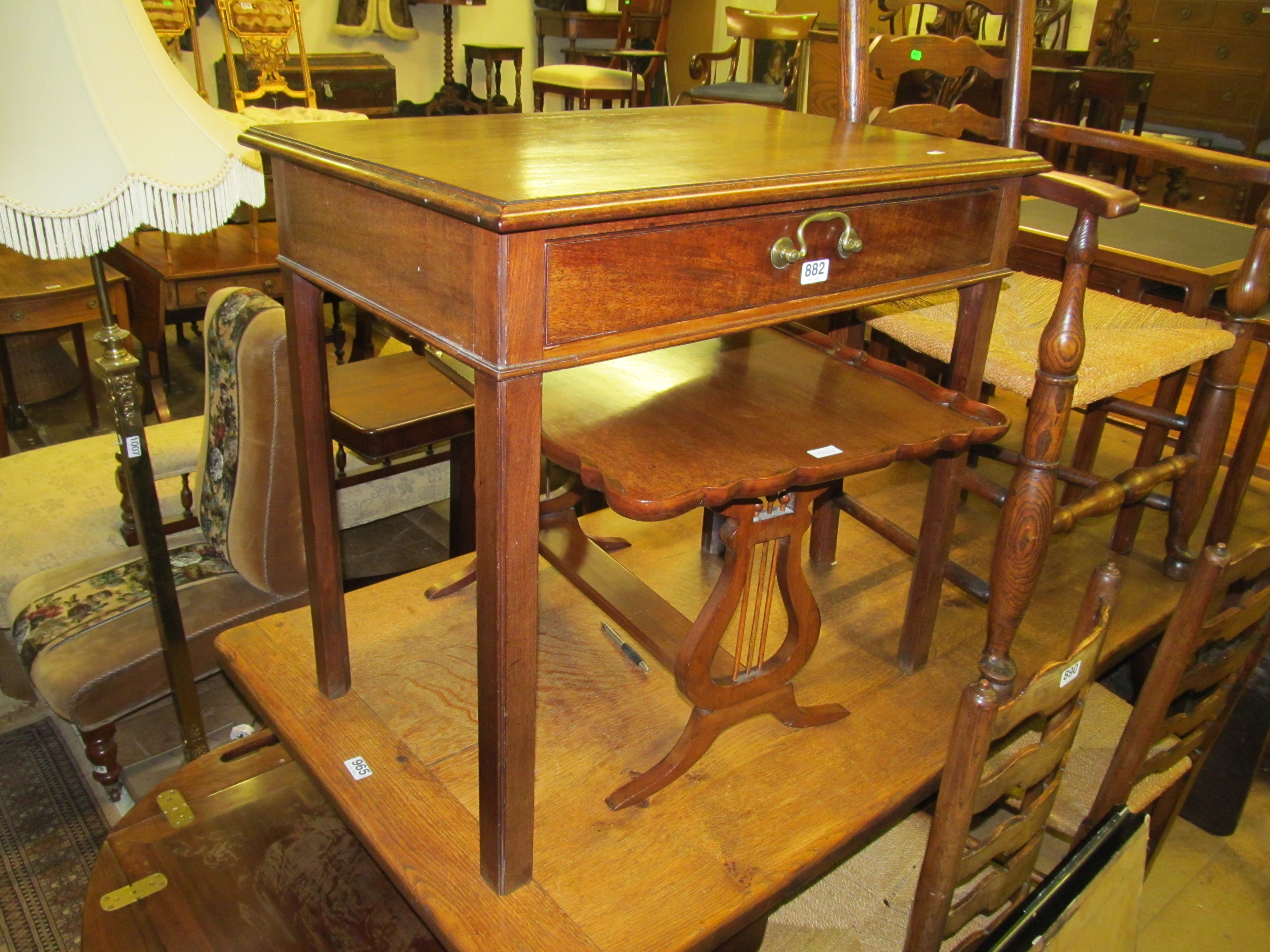 A 19th Century mahogany side table on tapered supports