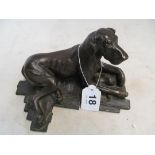 A bronze effect Great Dane lying down