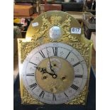 A brass longcase clock dial and chiming movement the face with brass spandrels, seconds dial and