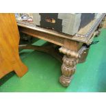 A large oak dining table on bulbous legs, with gadroon border.