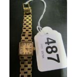 A 9ct gold watch on strap