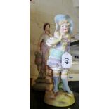 A coloured bisque model of a classical lady and two other bisque model of girls