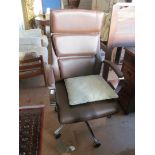 A brown leather upholstered modern desk chair