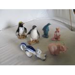 A Poole Pottery penguin and other animal ornaments