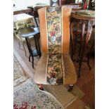 A Victorian chair with tapestry upholstery