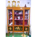 An Edwardian satinwood display cabinet, breakfront with painted floral panels, G.Pumfrey, on