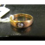 An 18ct gold gypsy set diamond ring