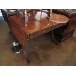 A Regency mahogany and rosewood banded sofa table, two drawers on twin splayed legs