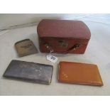 A leather jewellery case, leather cigarette case, plated cigarette case and compact