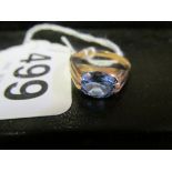 An 18ct gold blue stone ring.