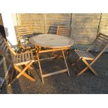 A garden table and four chairs