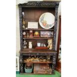 A Victorian carved oak open bookcase