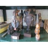 Fifteen small African carved figures and masks