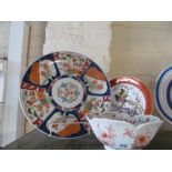 A modern oriental charger, plated decorated birds and a bowl