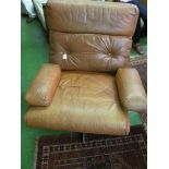 A Tetrad Nucleus brown leather swivel armchair