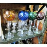 A part set of art glasses with gilt rims and four coloured hock glasses