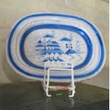 A 19th Century Delft oval plate decorated pagoda scenes.