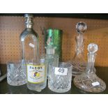 A ships' decanter, three others and three whisky glasses