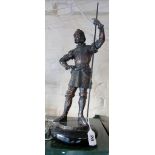 A bronze finish figure of a Knight.