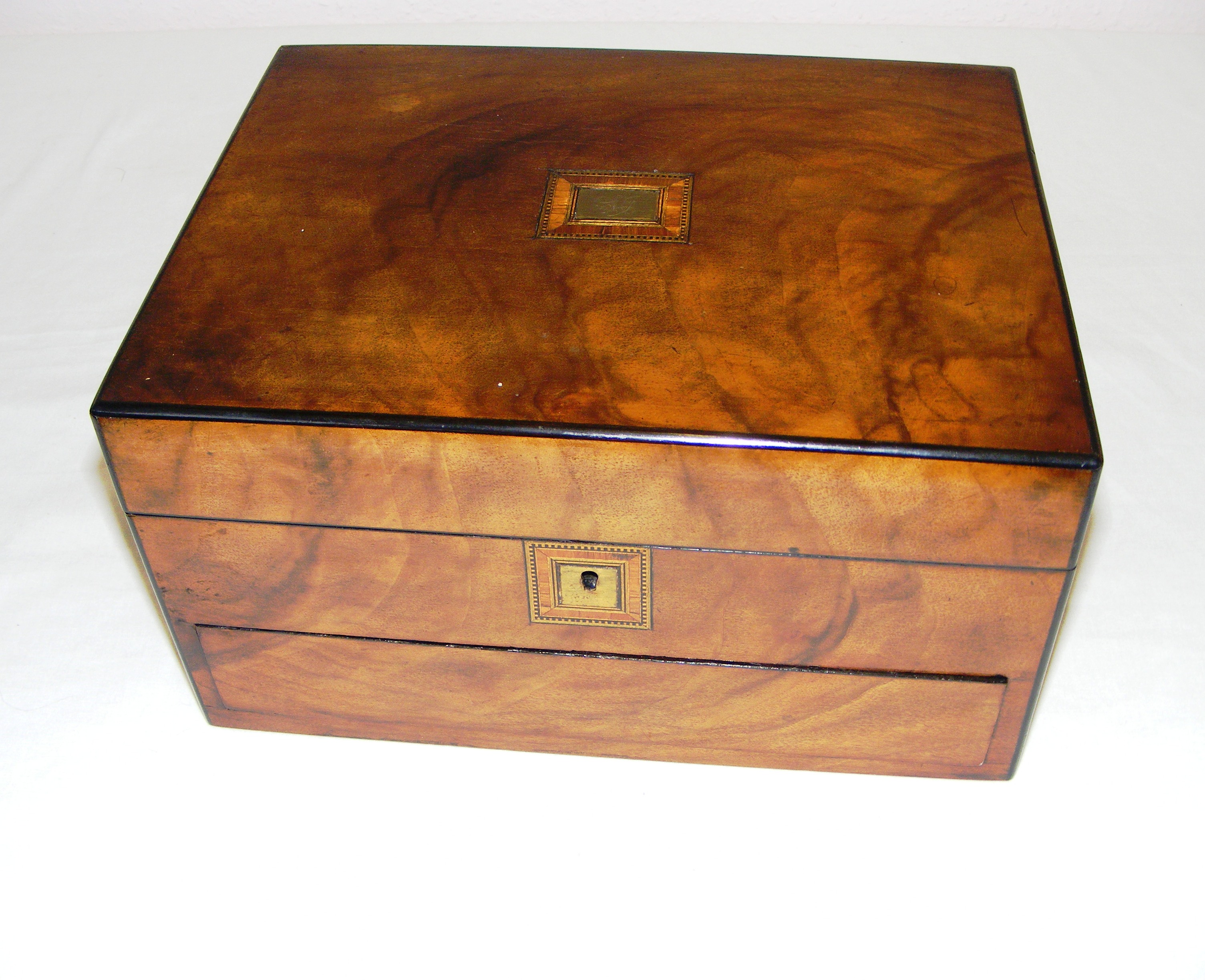 A late Victorian walnut and parquetry inlaid sewing box, with a drawer and fitted interior,