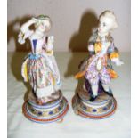 A pair of French Jean Gille bisque figurines of a boy and girl, each measuring 7.