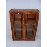 A mahogany display cabinet measuring 28" wide. CONDITION REPORT: Good condition.