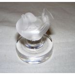 A Lalique frosted glass bird paperweight measuring 6cm tall and signed to the base.