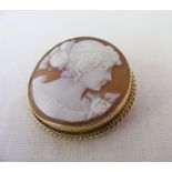 A 9ct gold cameo brooch depicting a classical lady, it measures 3.25cm in diameter and weighs 8.