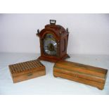 A modern Franz Hermle mantle clock standing on four scroll feet measuring 12" tall along with two