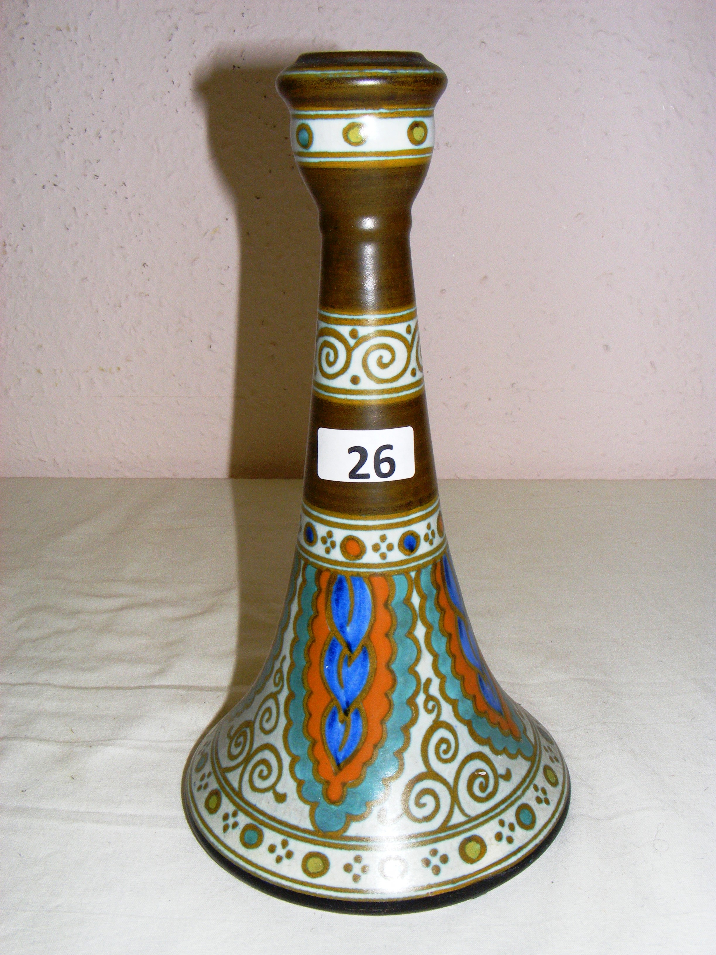 A Gouda Holland hat shaped vase measuring 11" tall, with various base markings.